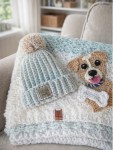 picture of a crocheted baby blanket, beanie and an applique puppy.
